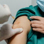 Female surgeon receiving coronavirus vaccine